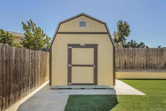 view of shed featuring a fenced backyard