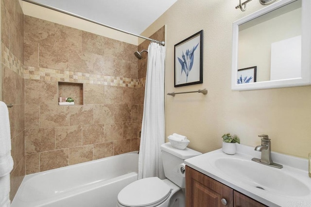 bathroom featuring vanity, toilet, and shower / tub combo with curtain