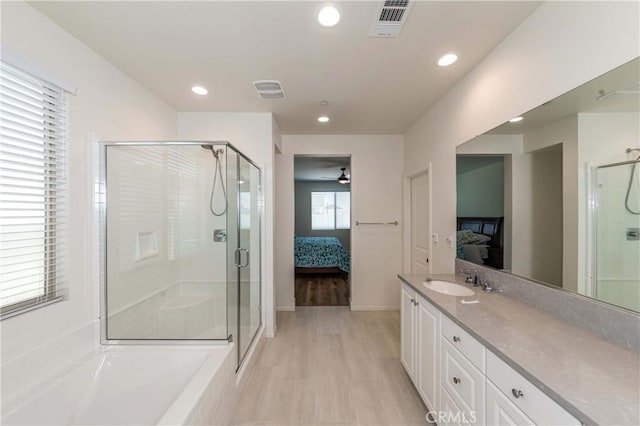 full bath with visible vents, recessed lighting, a stall shower, ensuite bathroom, and vanity