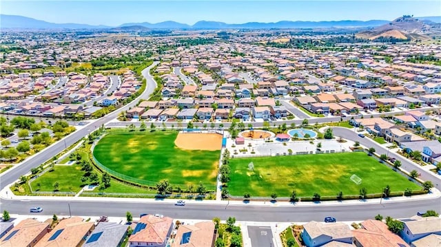 drone / aerial view featuring a residential view and a mountain view