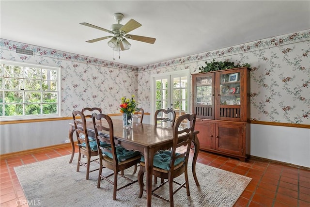 dining area with tile patterned flooring, plenty of natural light, french doors, and wallpapered walls