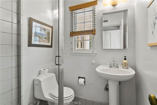 full bath featuring tile patterned flooring, visible vents, a shower stall, and toilet