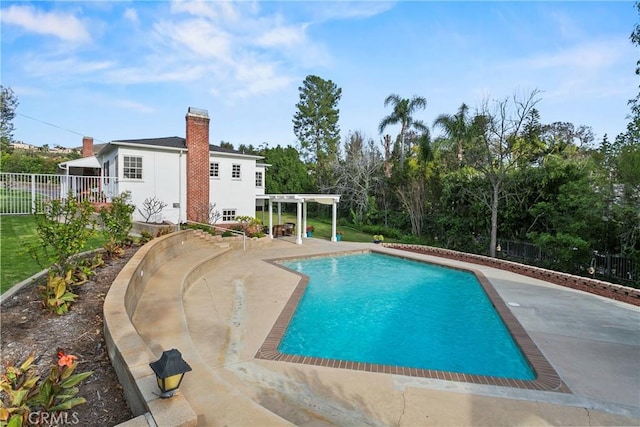 view of pool with a fenced in pool, a patio, fence, and a pergola