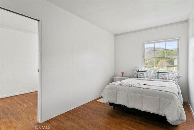 bedroom with wood finished floors