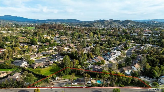 drone / aerial view featuring a mountain view and a residential view