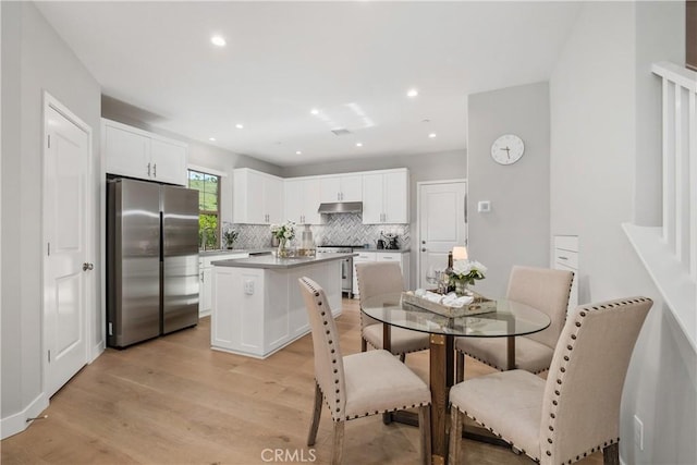 dining space featuring recessed lighting and light wood-type flooring