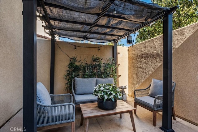 view of patio / terrace featuring an outdoor living space, fence, and a pergola