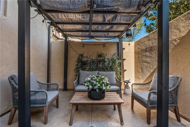 view of patio with an outdoor living space and a pergola