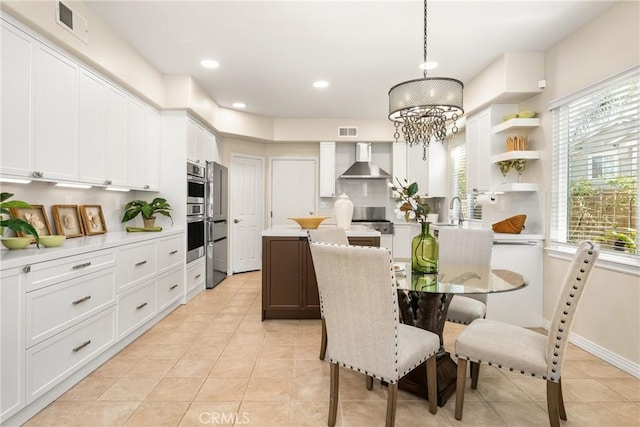 dining room featuring an inviting chandelier, light tile patterned flooring, recessed lighting, and visible vents