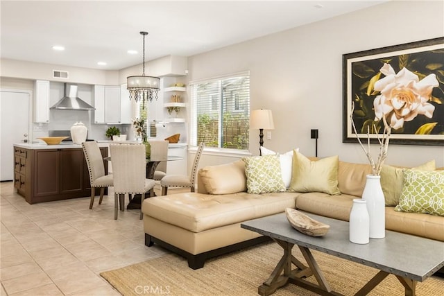 living room with a chandelier, visible vents, recessed lighting, and light tile patterned floors