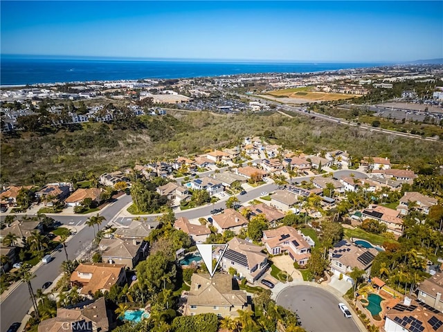 bird's eye view with a residential view and a water view