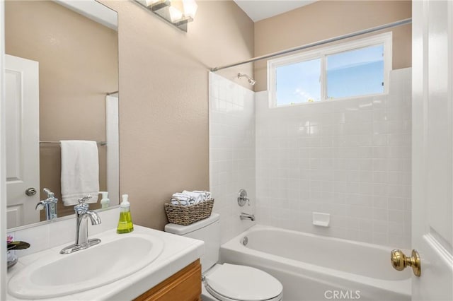 bathroom featuring vanity, toilet, and shower / bathing tub combination