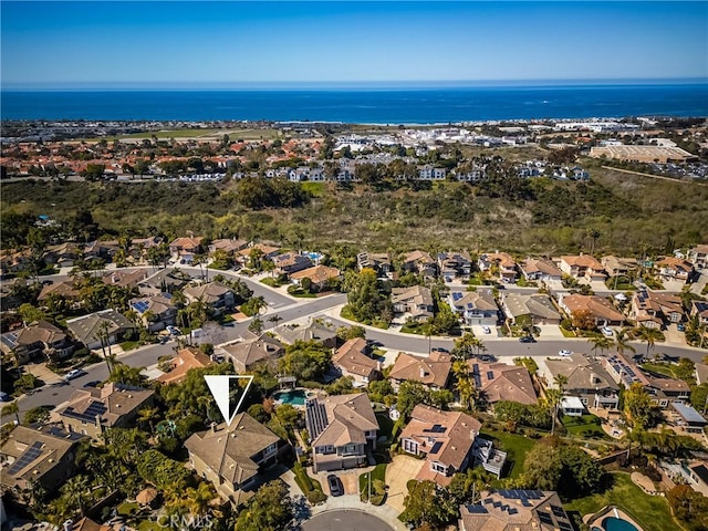 aerial view featuring a residential view and a water view