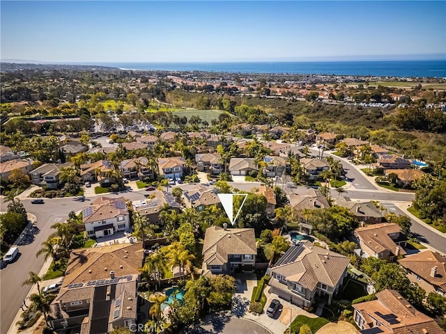 bird's eye view featuring a residential view and a water view