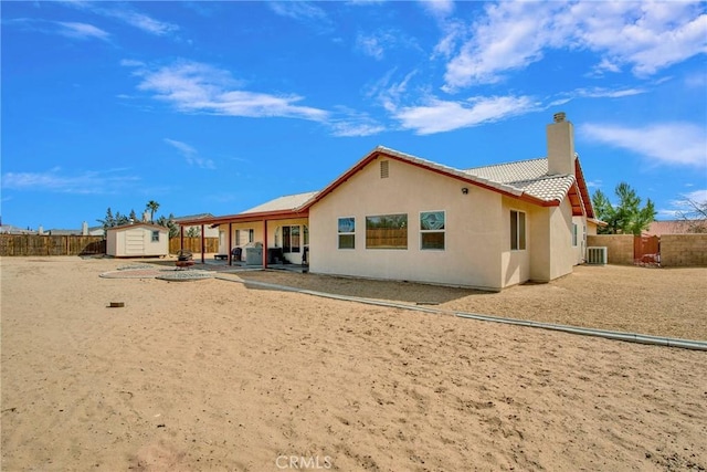 20368 Majestic Dr, Apple Valley, CA 92308 - rear view of property with a chimney, a tile roof, a fenced backyard, and stucco siding