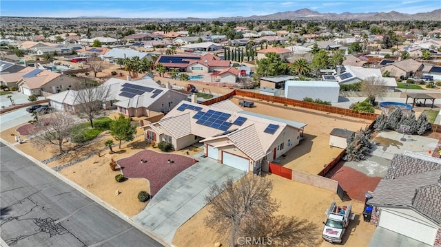 drone / aerial view featuring a residential view and a mountain view