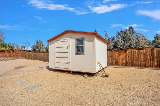 view of shed with a fenced backyard