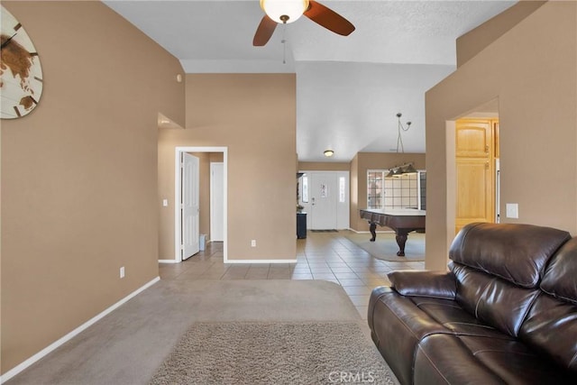 tiled living room featuring high vaulted ceiling, a ceiling fan, billiards, and baseboards