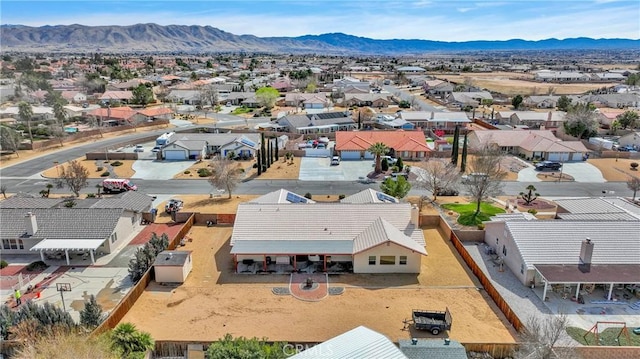 drone / aerial view featuring a residential view and a mountain view