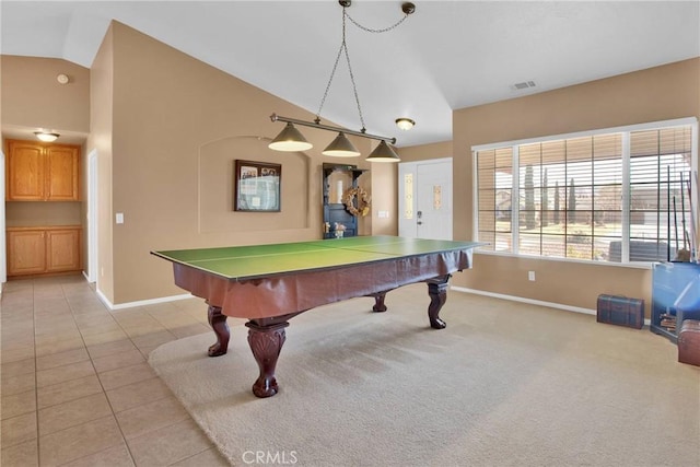 game room with baseboards, visible vents, lofted ceiling, light tile patterned flooring, and light carpet