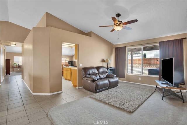 20368 Majestic Dr, Apple Valley, CA 92308 - living area featuring lofted ceiling, a ceiling fan, plenty of natural light, light tile patterned floors, and baseboards
