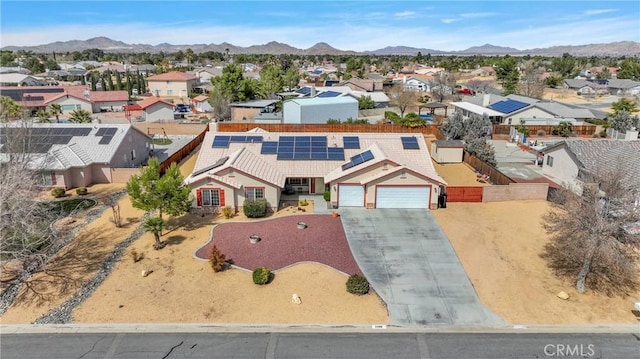 birds eye view of property featuring a mountain view and a residential view