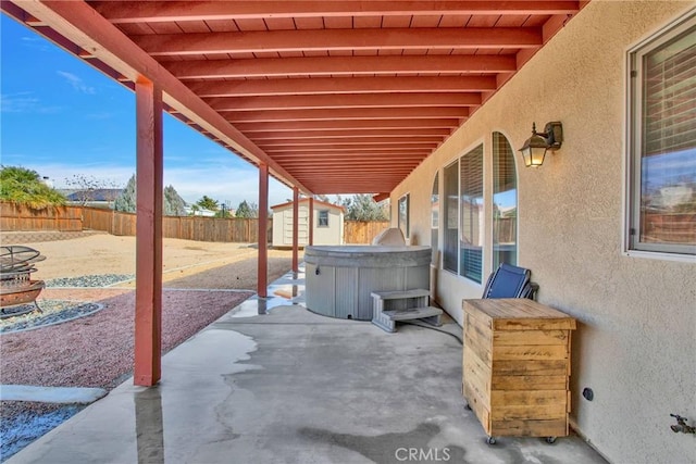 view of patio with a fenced backyard, a storage shed, and an outdoor structure