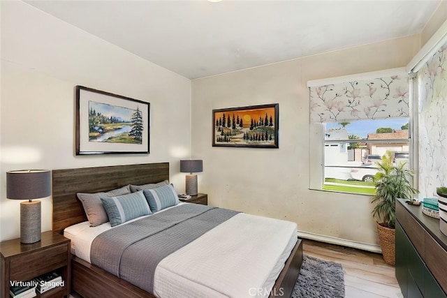 bedroom with wood finished floors