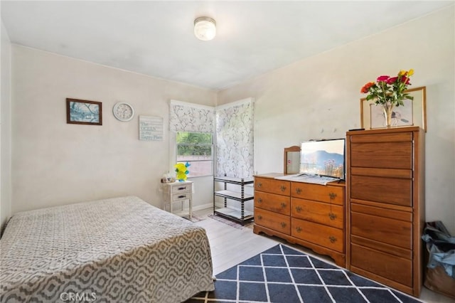 bedroom with light wood-type flooring