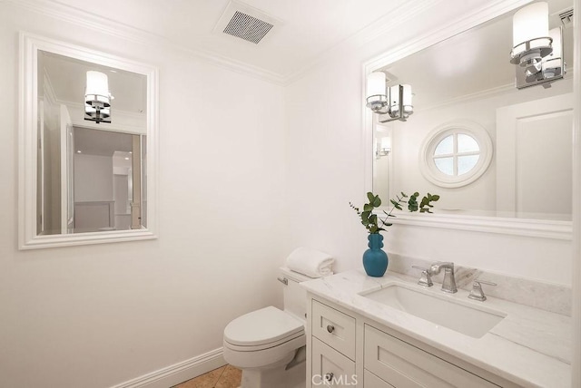 bathroom with visible vents, crown molding, baseboards, toilet, and vanity