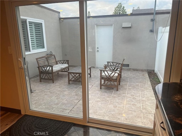 doorway to outside with tile patterned floors
