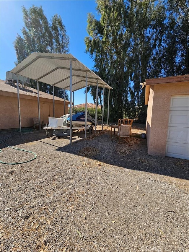 view of yard featuring a carport