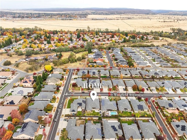 birds eye view of property with a residential view