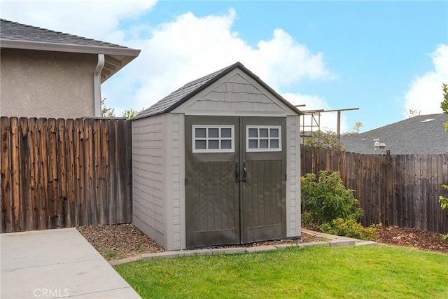 view of shed featuring a fenced backyard