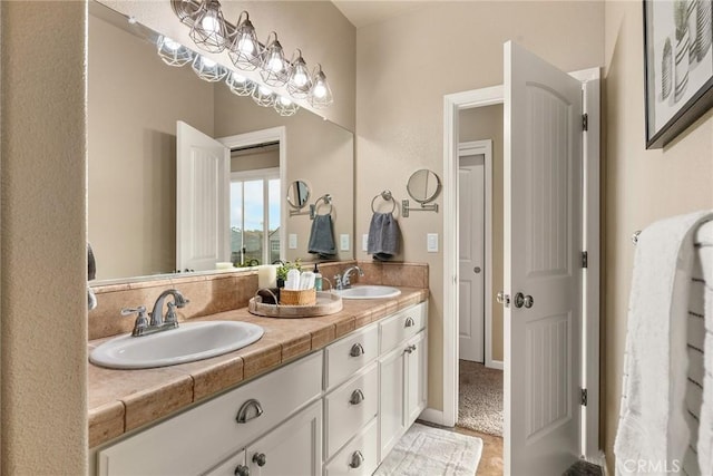 bathroom featuring double vanity and a sink