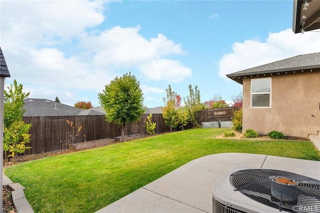 view of yard featuring central AC unit, a patio, and a fenced backyard