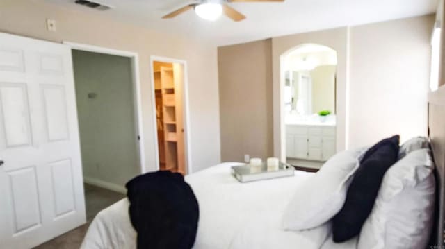 2203 Huntington Point Dr Unit 4, Chula Vista, CA 91914 - bedroom with arched walkways, ensuite bathroom, and a ceiling fan