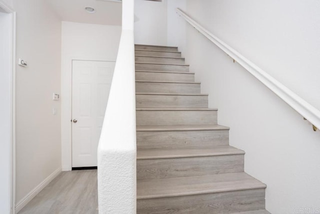 2203 Huntington Point Dr Unit 4, Chula Vista, CA 91914 - stairway with wood finished floors and baseboards