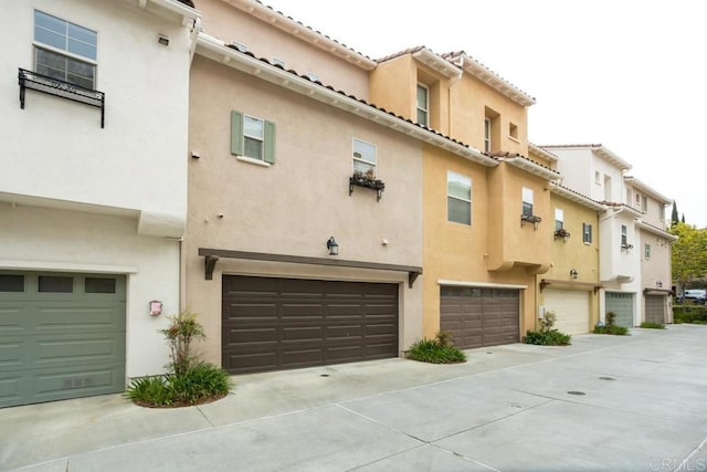 2203 Huntington Point Dr Unit 4, Chula Vista, CA 91914 - exterior space featuring an attached garage and stucco siding