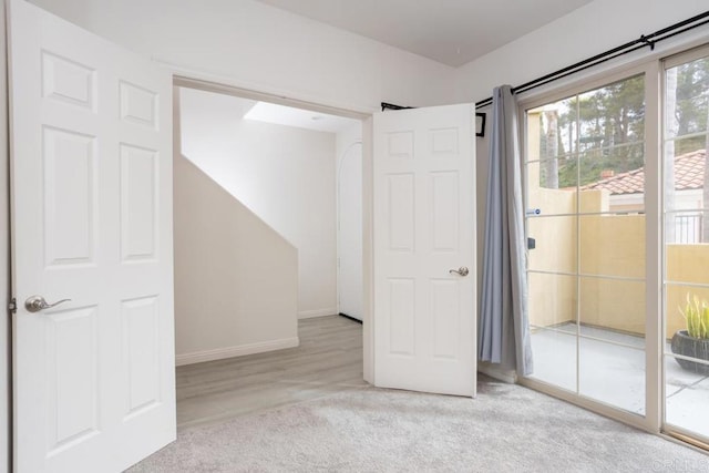 2203 Huntington Point Dr Unit 4, Chula Vista, CA 91914 - unfurnished bedroom with access to outside, baseboards, and carpet flooring