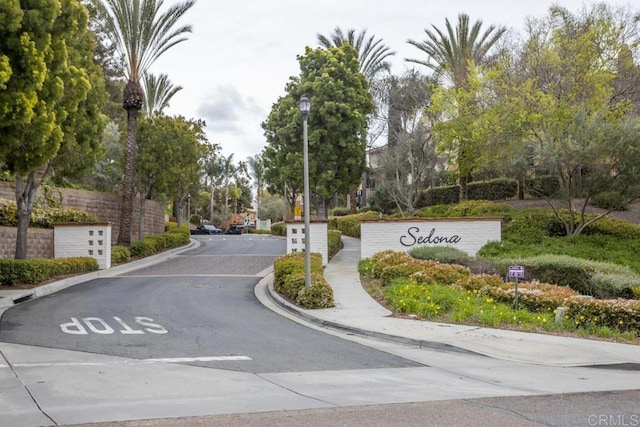 2203 Huntington Point Dr Unit 4, Chula Vista, CA 91914 - view of asphalt street with curbs, street lights, and sidewalks