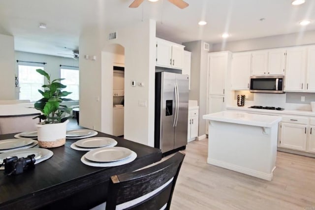 2203 Huntington Point Dr Unit 4, Chula Vista, CA 91914 - kitchen featuring stainless steel appliances, a ceiling fan, white cabinetry, light countertops, and recessed lighting