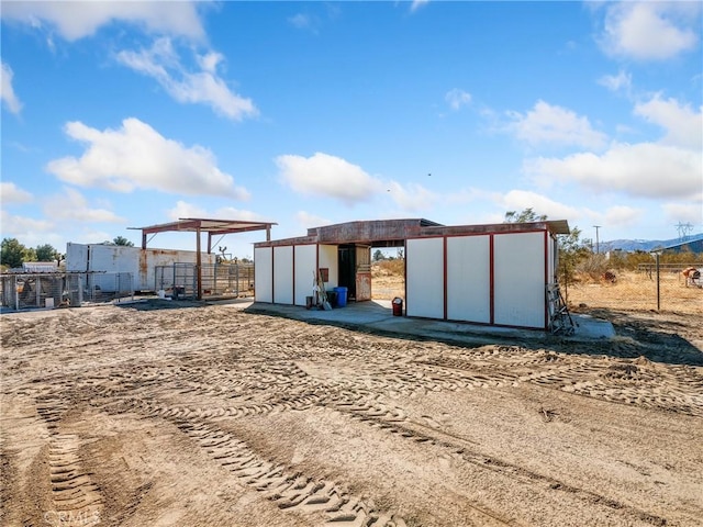 view of outdoor structure featuring an outdoor structure and fence