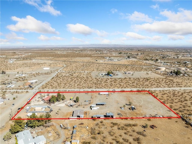 birds eye view of property with a rural view and a desert view