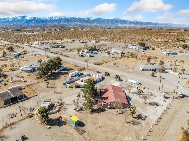 bird's eye view with a mountain view and a desert view