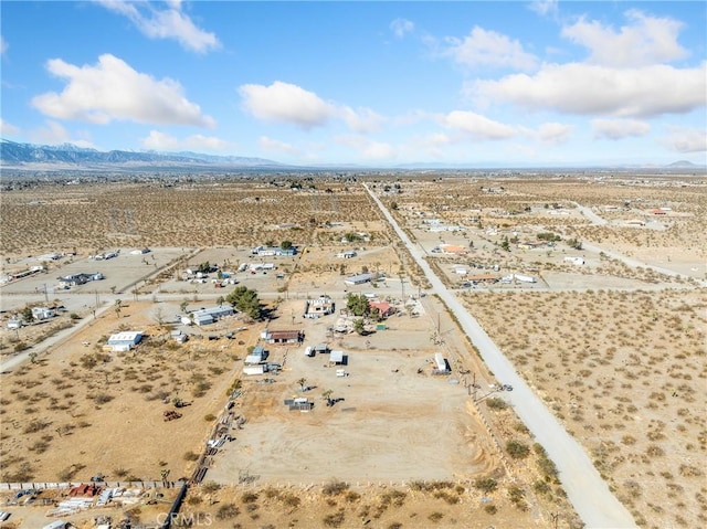 aerial view with a mountain view, a rural view, and a desert view