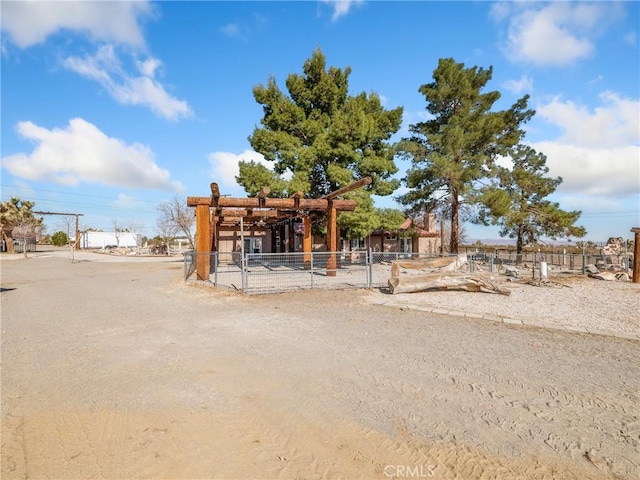 view of front of home featuring fence