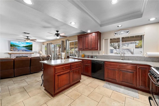 kitchen with visible vents, a tray ceiling, a sink, black dishwasher, and gas range