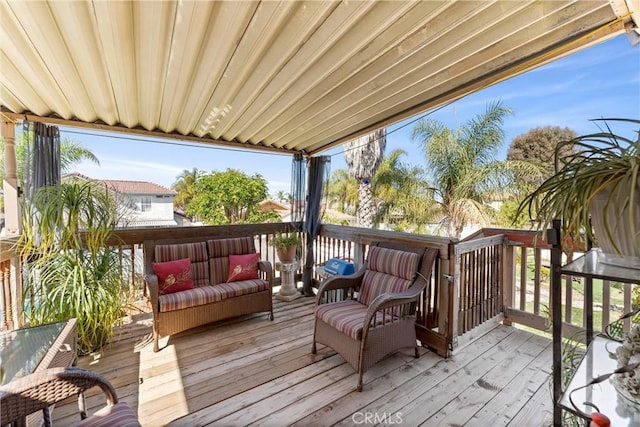 wooden terrace featuring outdoor lounge area