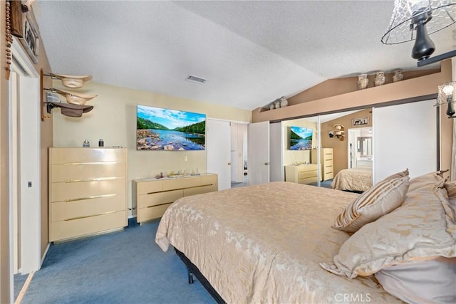 bedroom with visible vents, a textured ceiling, lofted ceiling, and carpet floors